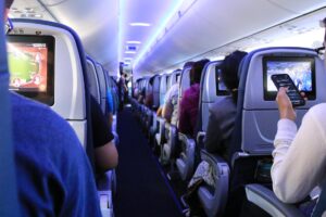 Airplane aisle with passengers